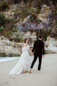 Bride and groom on the sand in Laguna Beach, California 