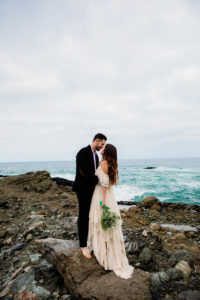 Bride and groom on the sand in Laguna Beach, California 